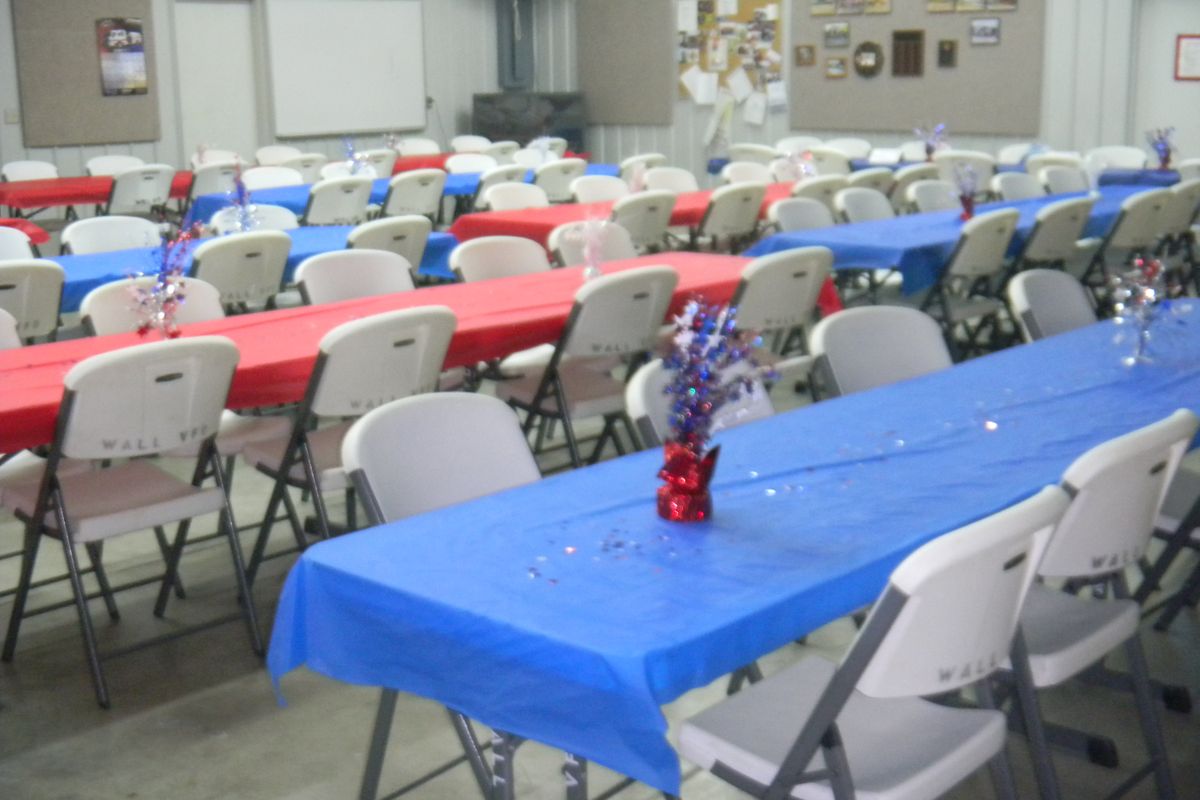 Saint Ambrose Parish Hall set with red, white and blue tables