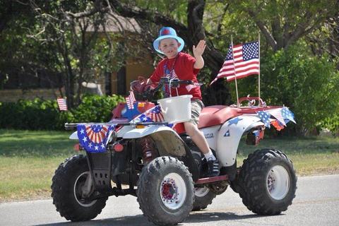Rider in patriotic costume on a four-wheeler