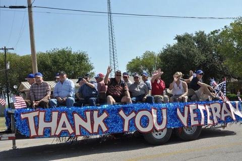 Thank You Veterans float rolling down the street