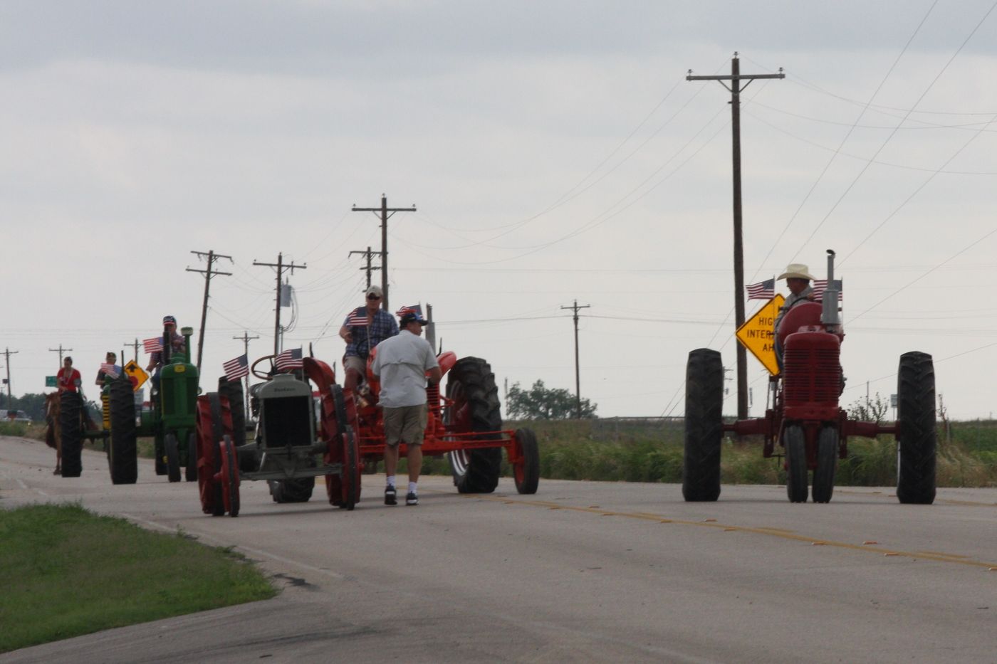 Line of antique tractors in the parade