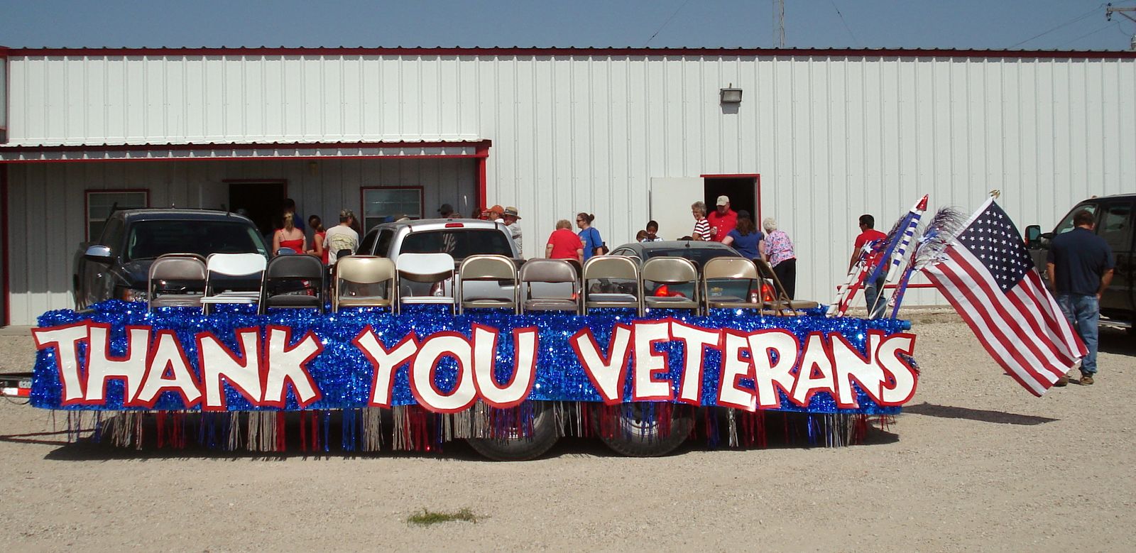 Veterans seated on the Thank You Veterans float