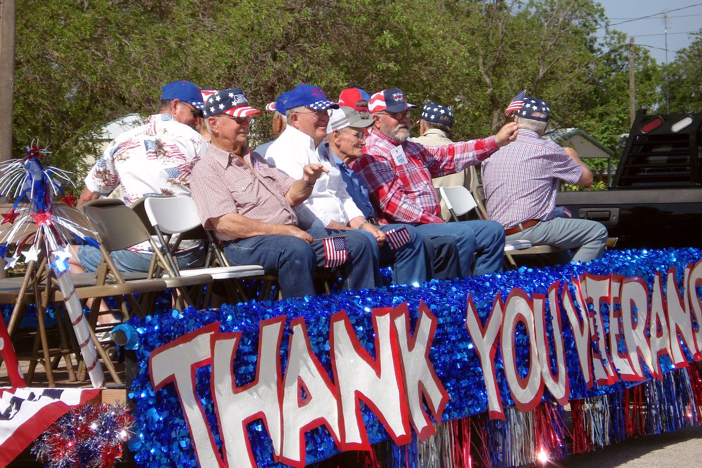 Thank You Veterans float carrying local veterans
